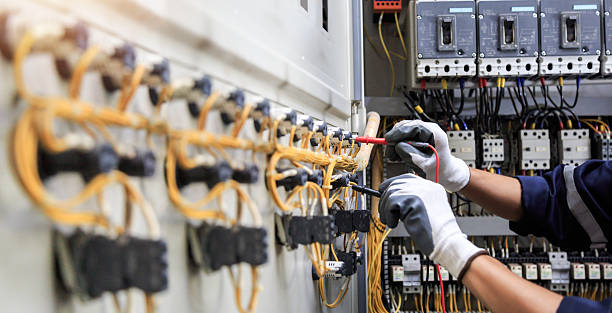 Professional Electrician technician working in Highfill, AR